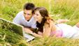 cheerful,computers,couples,fields,fun,happiness,iStockphoto,laptop computers,meadows,men,nature,outdoors,Photographs,relaxation,summer,togetherness,twenties,women,working,young adult